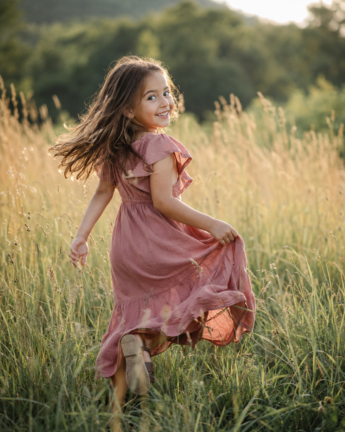 A child running through a warm meadow at golden hour